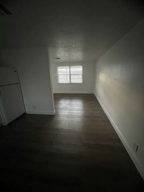 North Fort Myers apartment for rent - A white refrigerator sits in a room with a window.