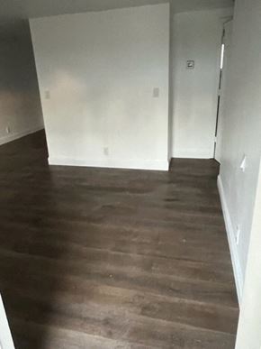 North Fort Myers apartment for rent - a living room with white walls and a wooden floor