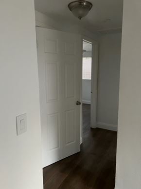 North Fort Myers apartment for rent - A hallway with a white door and a light on the ceiling.