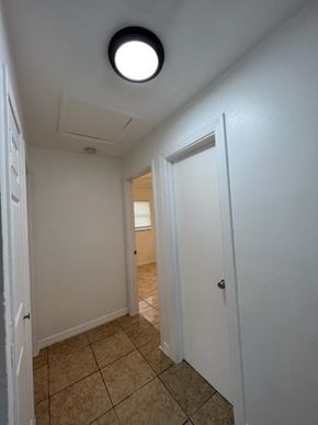 Fort Myers apartment for rent - A hallway with a white door and a light on the ceiling.