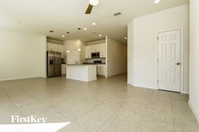 Bartow house for rent - an open kitchen and living room with a large tile floor