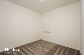 Bartow house for rent - a bedroom with white walls and carpet and a window