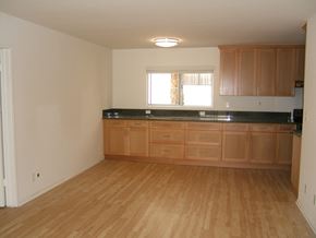 Los Angeles apartment for rent - A kitchen with wooden floors and cabinets.