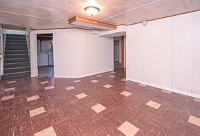 Grand Forks house for rent - A room with a checkered floor and white walls.