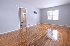 Grand Forks house for rent - A room with wooden floors and a window.