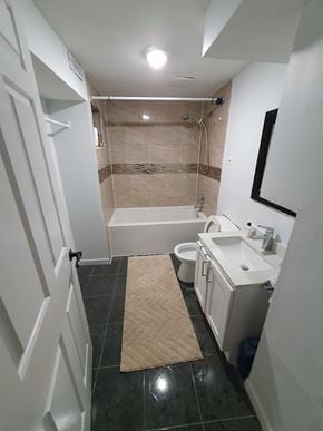 Toronto house for rent - a small bathroom with a toilet sink and bath tub