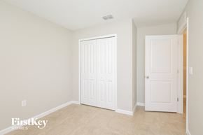 Winter Haven house for rent - a bedroom with two closets and a white door
