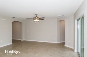 Winter Haven house for rent - a empty living room with a ceiling fan