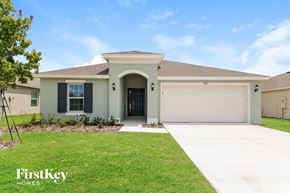 Winter Haven house for rent - A house with a garage door is for sale by FirstKey Homes.