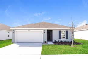 Winter Haven house for rent - A white house with a brown roof and a white garage door.