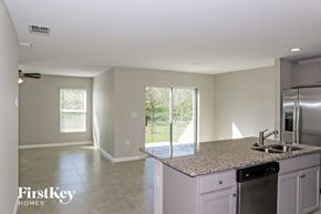 Winter Haven house for rent - A kitchen with a granite countertop and a dishwasher.
