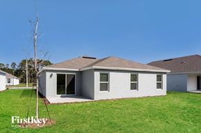 Winter Haven house for rent - A house with a white exterior and a brown roof is shown.