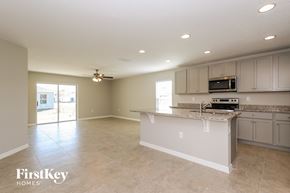 Winter Haven house for rent - A kitchen with a countertop and a microwave.