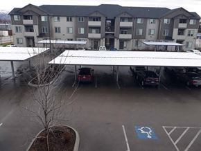 Boise apartment for rent - awning over a parking lot in front of an apartment building