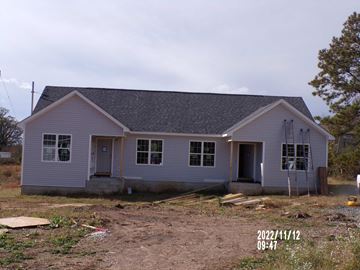 Franklinton apartment for rent - A house under construction with a grey roof and white walls.