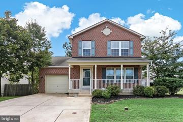 Edgewood house for rent - A house with a brick facade and a white garage door.