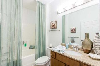 Sleek, shaker-style maple cabinetry in kitchens and baths