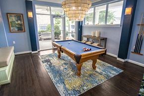 Virginia Beach apartment for rent - A pool table in a room with a view outside.