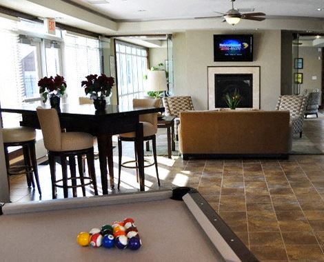 Newport News condo for rent - a living room with a pool table and a television