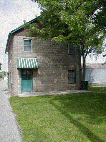 Gettysburg apartment for rent - an old brick building with a green door and a tree