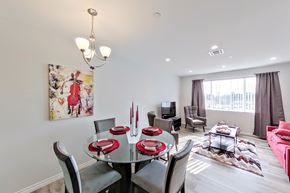 Norwalk apartment for rent - a dining room with a glass table and chairs