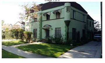Los Angeles apartment for rent - a green house with a sidewalk in front of it