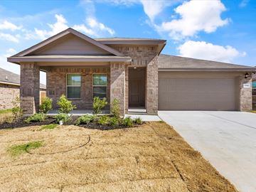 Azle house for rent - A house with a brown roof and a garage door.