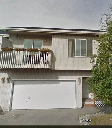 Anchorage apartment for rent - the front of a house with a white garage door