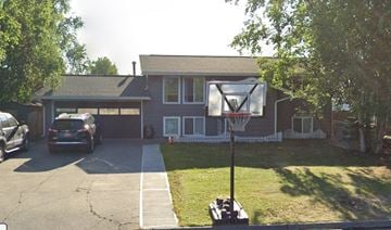 Anchorage apartment for rent - A basketball hoop is in the front yard of a house.