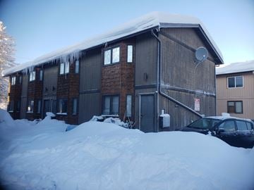 Anchorage apartment for rent - a house with a lot of snow in front of it