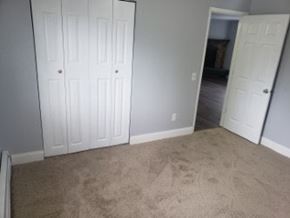 Anchorage apartment for rent - A room with two white doors and carpeted floor.