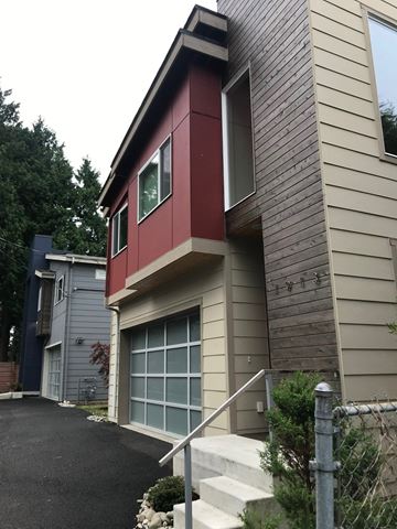 Seattle house for rent - A modern house with a red and beige exterior.