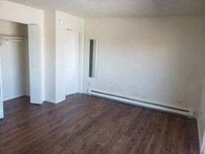 Anchorage apartment for rent - A room with wood floors and white walls.