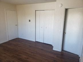 Anchorage apartment for rent - A room with white doors and wood floors.