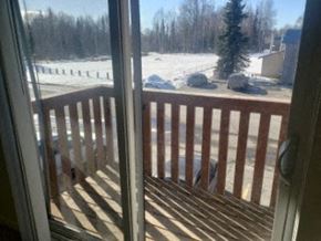 Anchorage apartment for rent - A view from a doorway looking out to a snowy landscape.