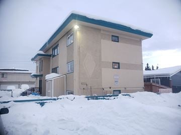 Anchorage apartment for rent - a building with snow in front of it