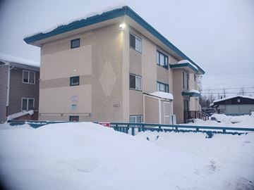 Anchorage apartment for rent - a building with snow in front of it