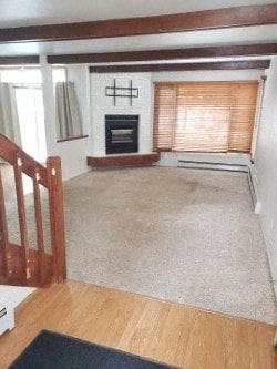 Anchorage apartment for rent - A living room with a fireplace and a rug on the floor.