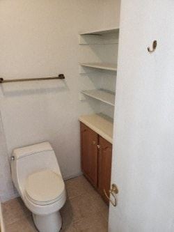 Anchorage apartment for rent - A white toilet in a small bathroom with a white door.