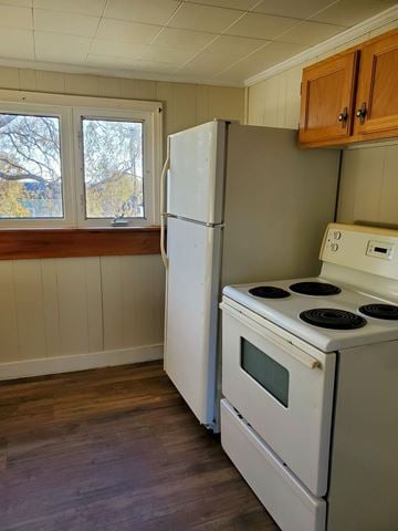 Westville apartment for rent - A white refrigerator and oven in a kitchen with wooden floors and a window.