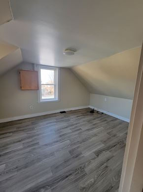 Westville apartment for rent - A room with a window and wooden flooring.