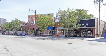 Chicago apartment for rent - a street view of a city street with shops and trees