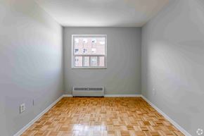 Brampton apartment for rent - A room with a window and a radiator on the floor.