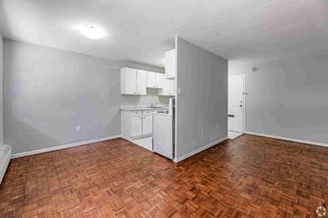 Brampton apartment for rent - A kitchen area with a refrigerator, cabinets, and a countertop.