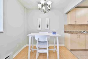 Mississauga apartment for rent - A dining room with a white table and chairs.
