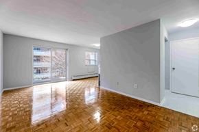 Brampton apartment for rent - A room with wooden flooring and white walls.
