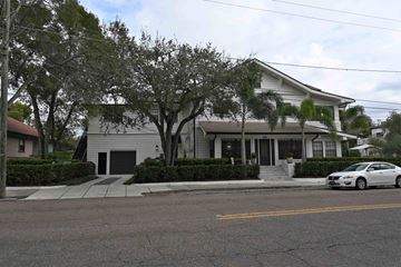 Tampa apartment for rent - a white house with a car parked in front of it