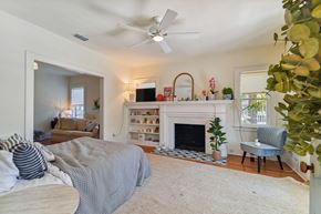 Tampa apartment for rent - a bedroom with a bed and a white fireplace