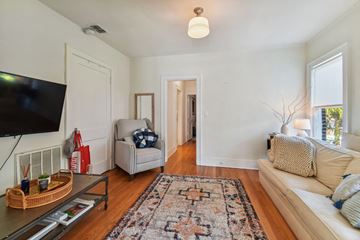Tampa apartment for rent - a living room with a couch and a chair and a tv