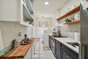Tampa apartment for rent - a kitchen with a counter top and a stove and a sink
